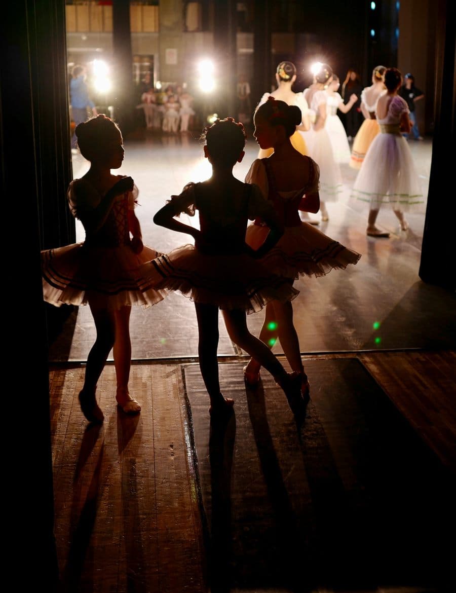Young ballet dancers waiting backstage for a performance